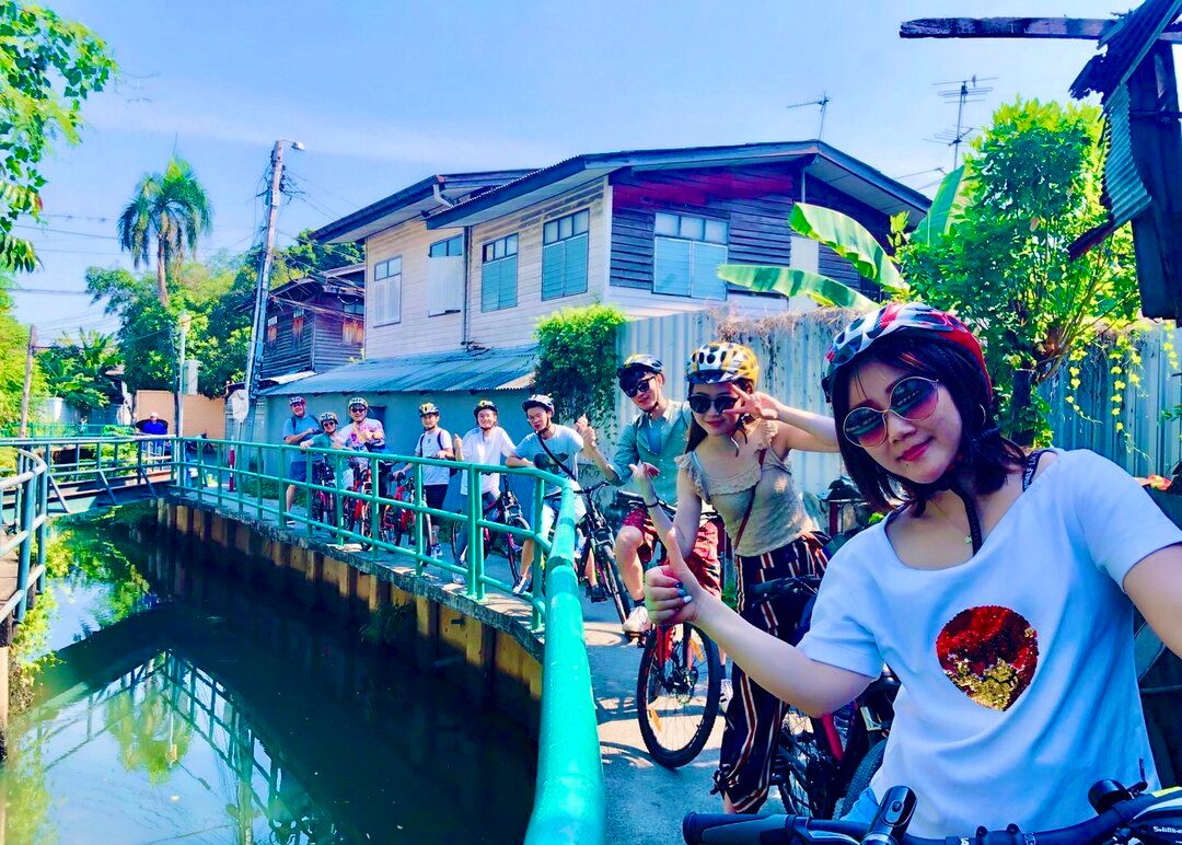 Time travel along the Chao Phraya River with the Hidden Bike & Food Tour.